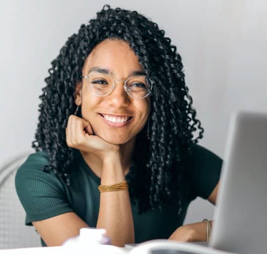 Woman smiling on laptop